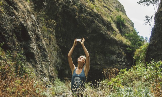 Woman in nature taking photo